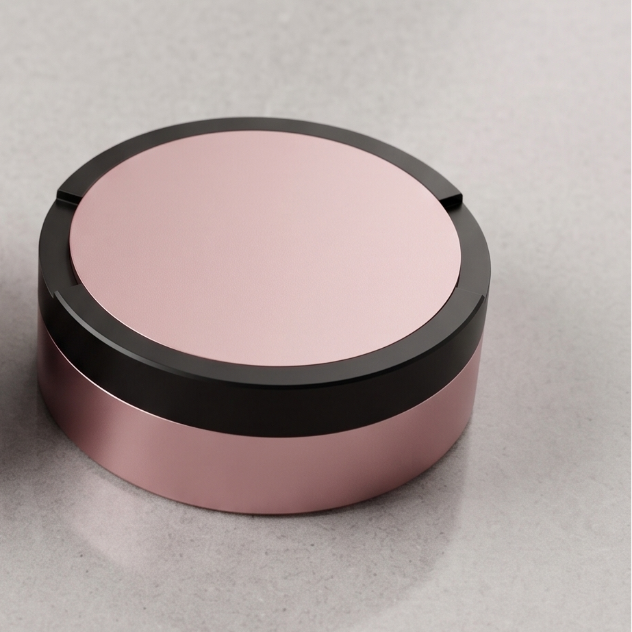 Tvåfärgad snusdosa i aluminium med rosa lock och botten samt svart ring i mitten från Duo Edition.